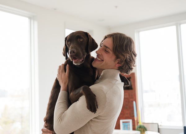 man holding dog